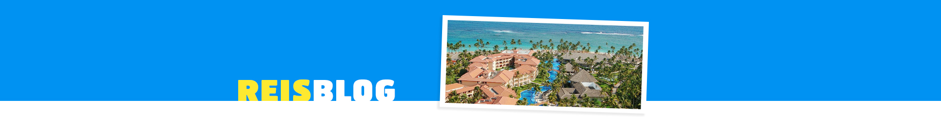 Hotel Majestic colanial Punta Cana, met vakantiehuizen in het groen en zee op de achtergrond